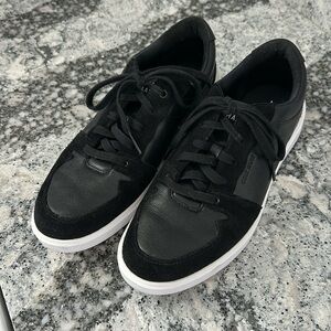 Cole Haan black women’s Grand Crosscourt sneakers.